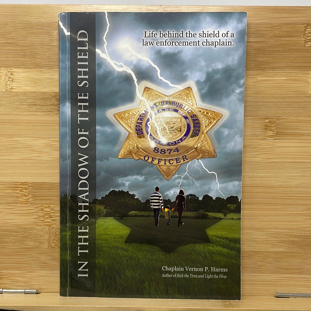 In the shadow of the shield life behind the shield of a law enforcement chaplain by chaplain Vernon P Harms